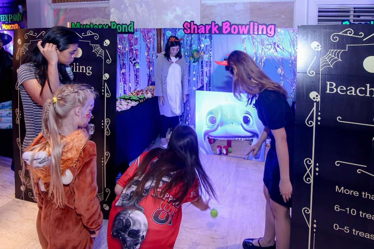 children playing at game booth