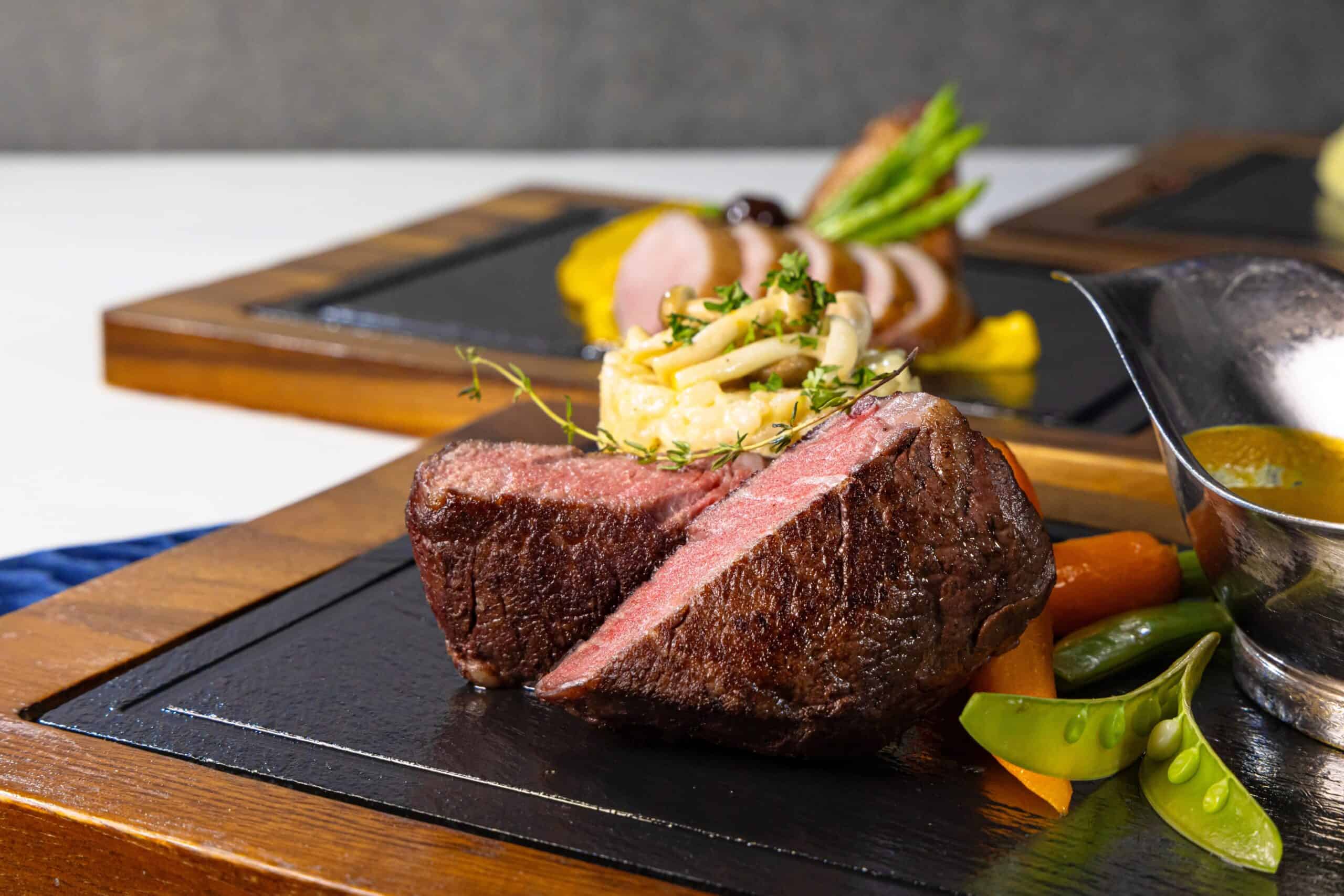 perfectly cooked steak at pattaya hotel restaurant, royal grill room