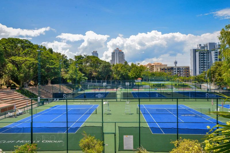 Wide view of floodlit tennis courts at Pattaya sports club